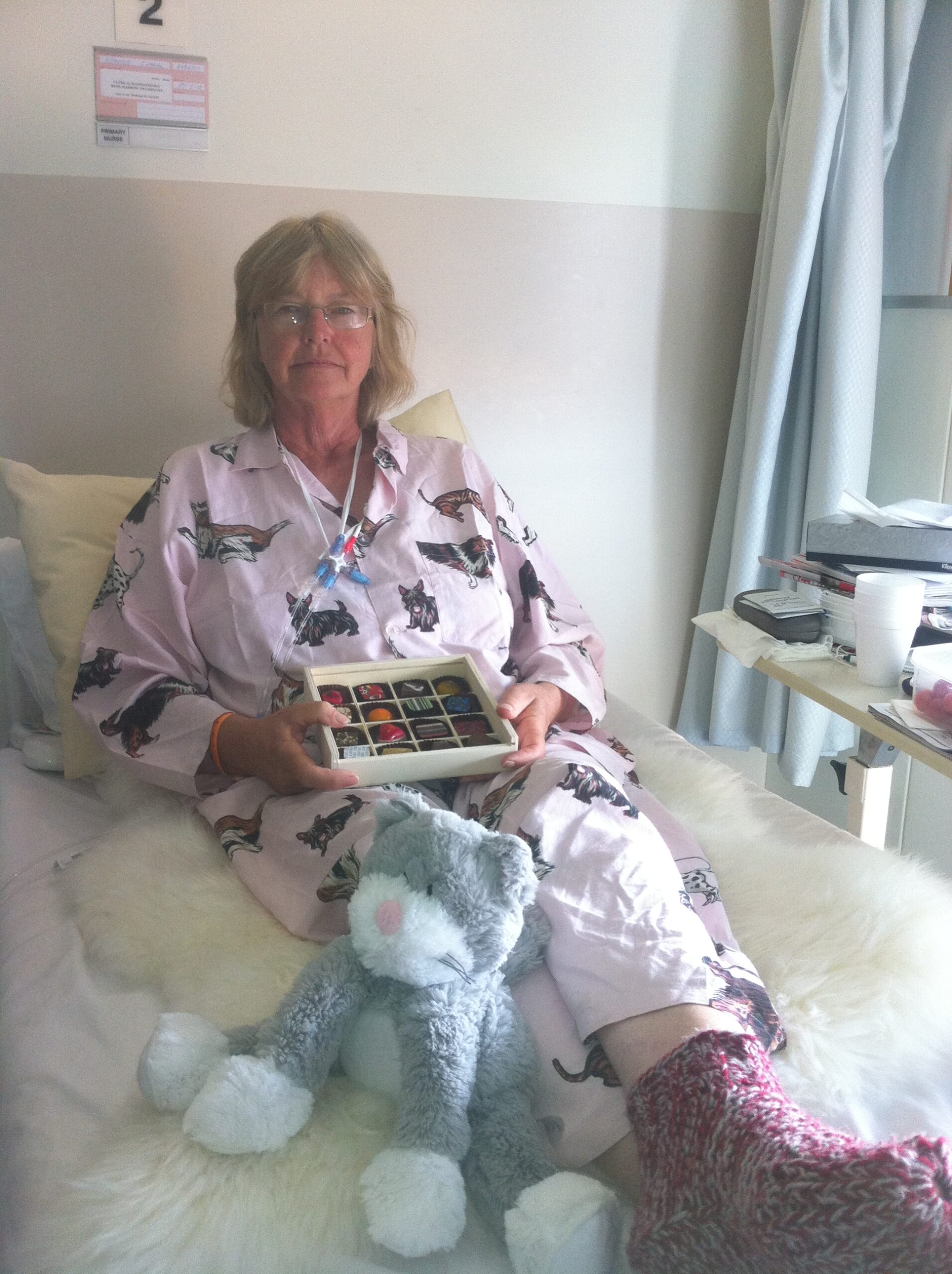 Cathy pic in bed with chocolates 1 April 2012